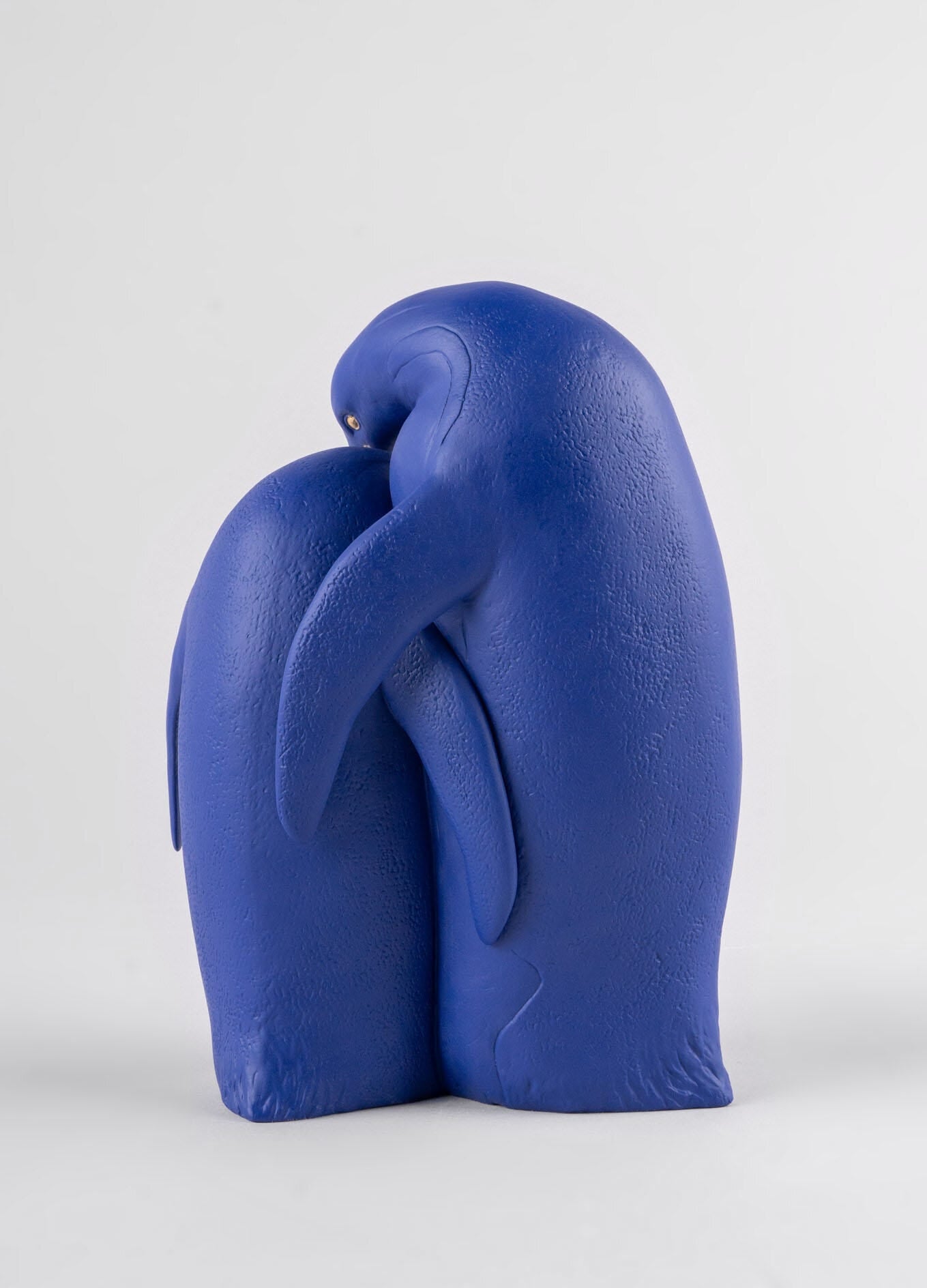 01009539 | Escultura Familia de pingüinos. Serie Limitada. Azul y dorado