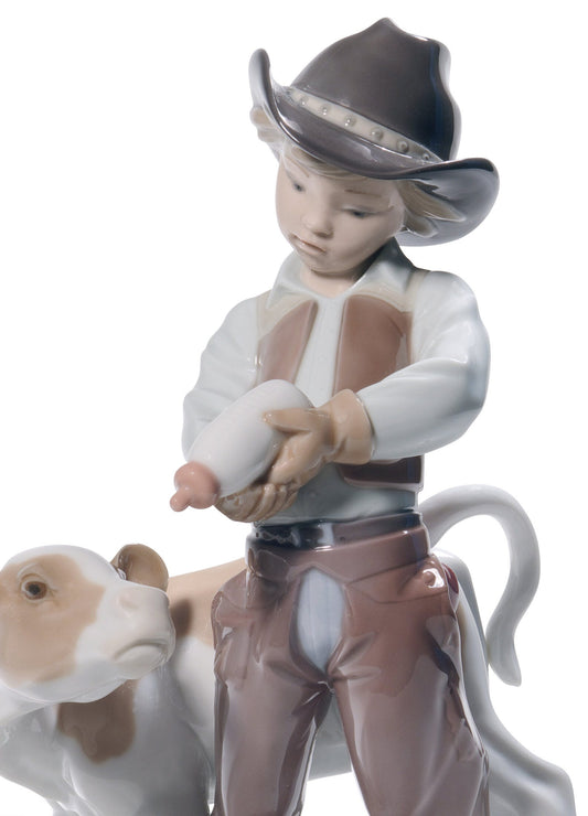 01008637 | Figura niño Vaquerito con ternero