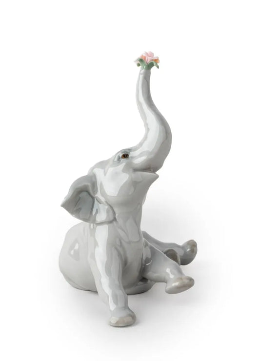 01008491 | Figura Elefante bebé con flor rosa