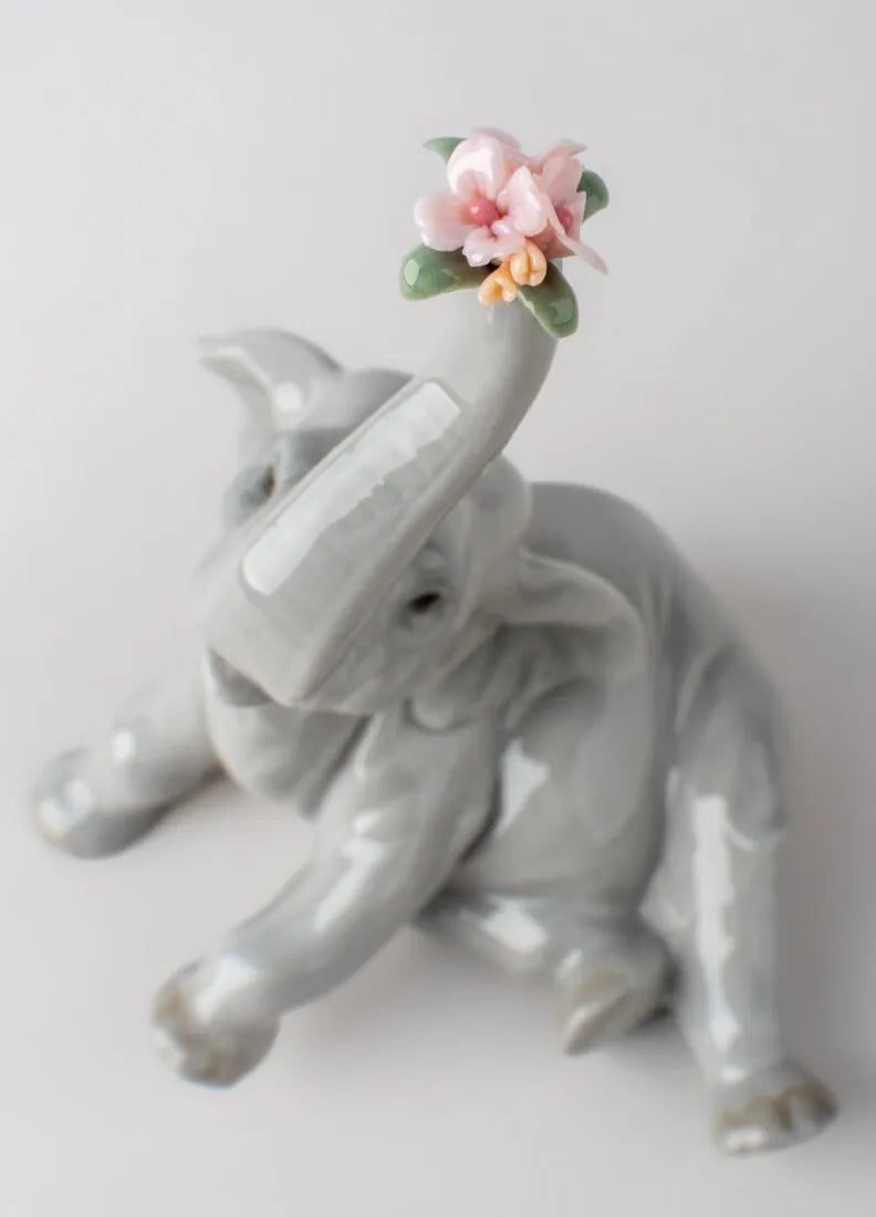 01008491 | Figura Elefante bebé con flor rosa