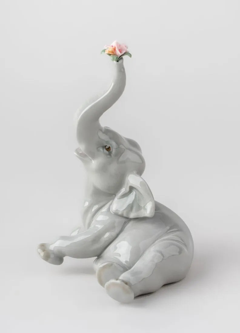 01008491 | Figura Elefante bebé con flor rosa