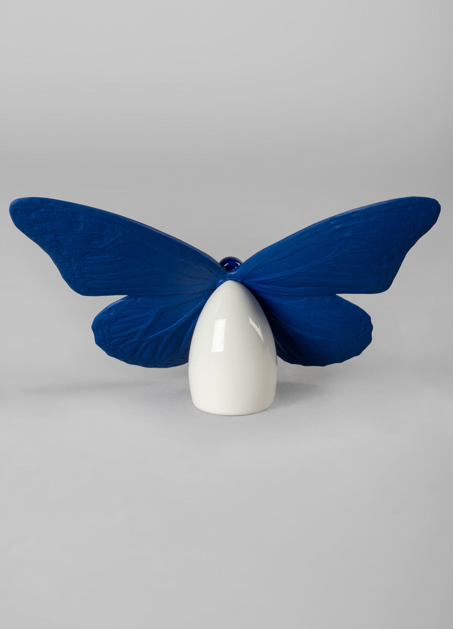 01009452 | Figura Mariposa. Lustre oro y azul