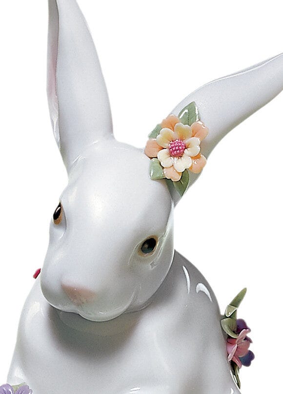 01006100 | Figura Conejito sentado con flores