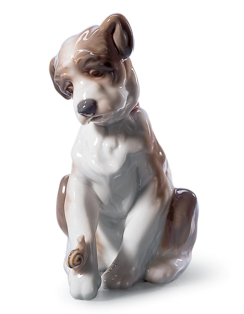 01006211 | Figura Perrito con caracol
